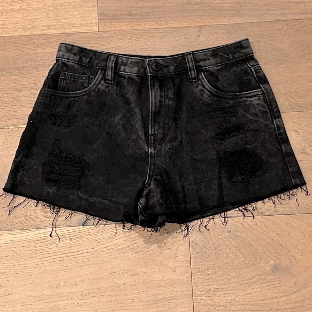 EUC size eur 38 black distressed denim with bottom fringe